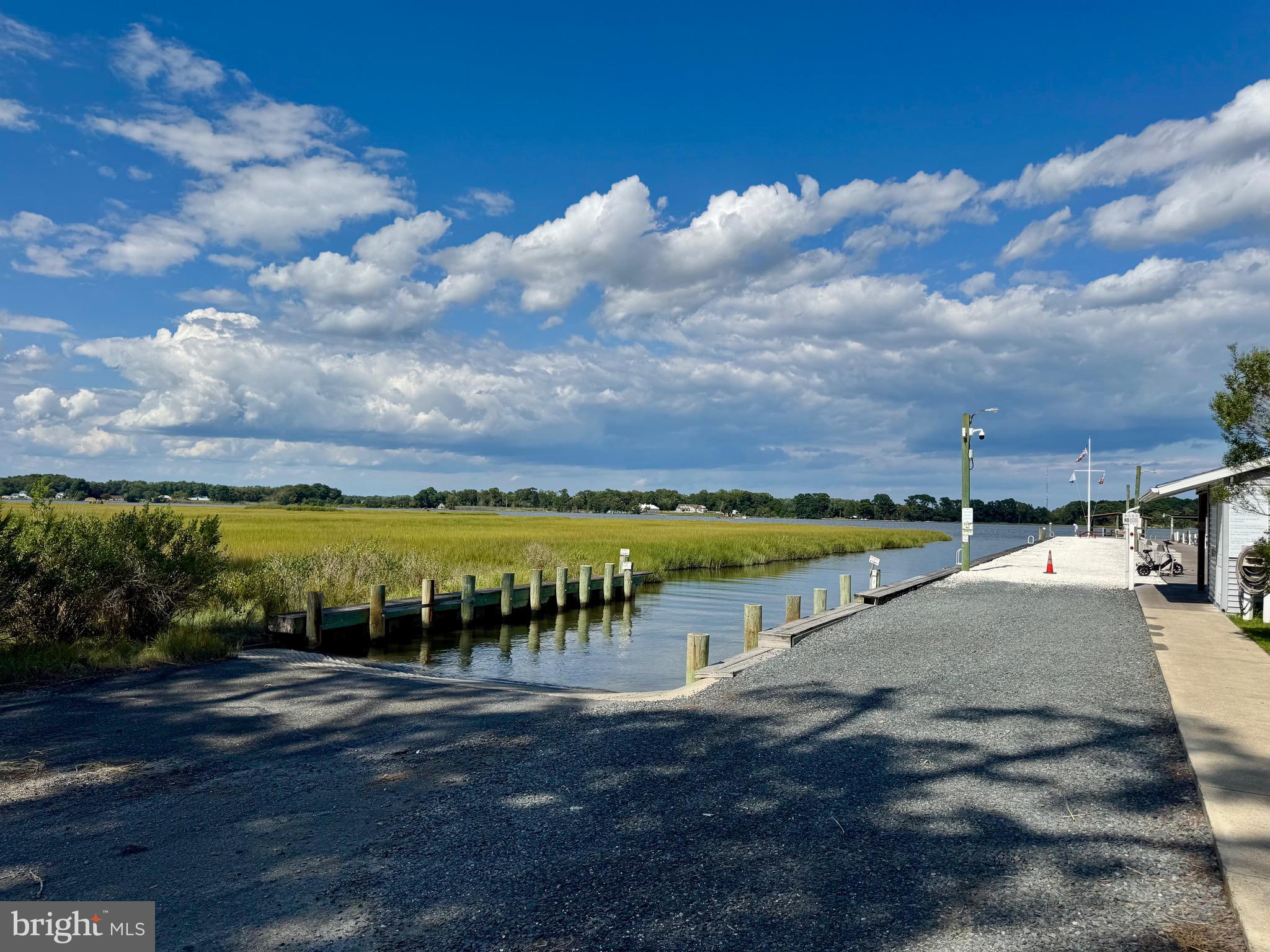 289 Woodhaven Court Berlin, MD 21811 - Photo 8 of 16 a view of a lake with houses in back