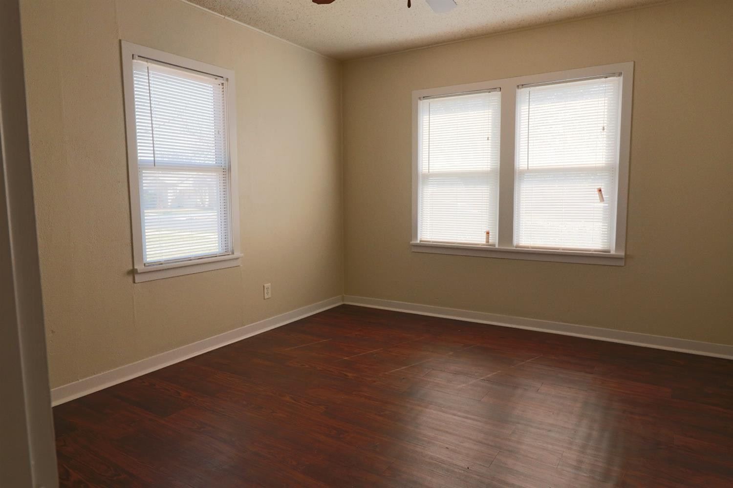 2426 26th Street Lubbock, TX 79411 - Photo 4 of 10 an empty room with a window