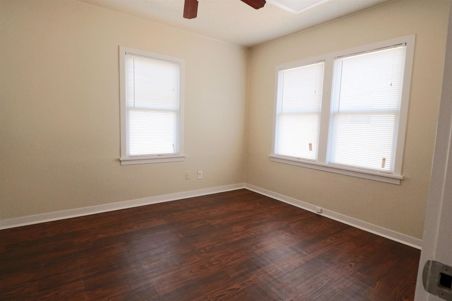 2426 26th Street Lubbock, TX 79411 - Photo 7 of 10 an empty room with wooden floor and windows