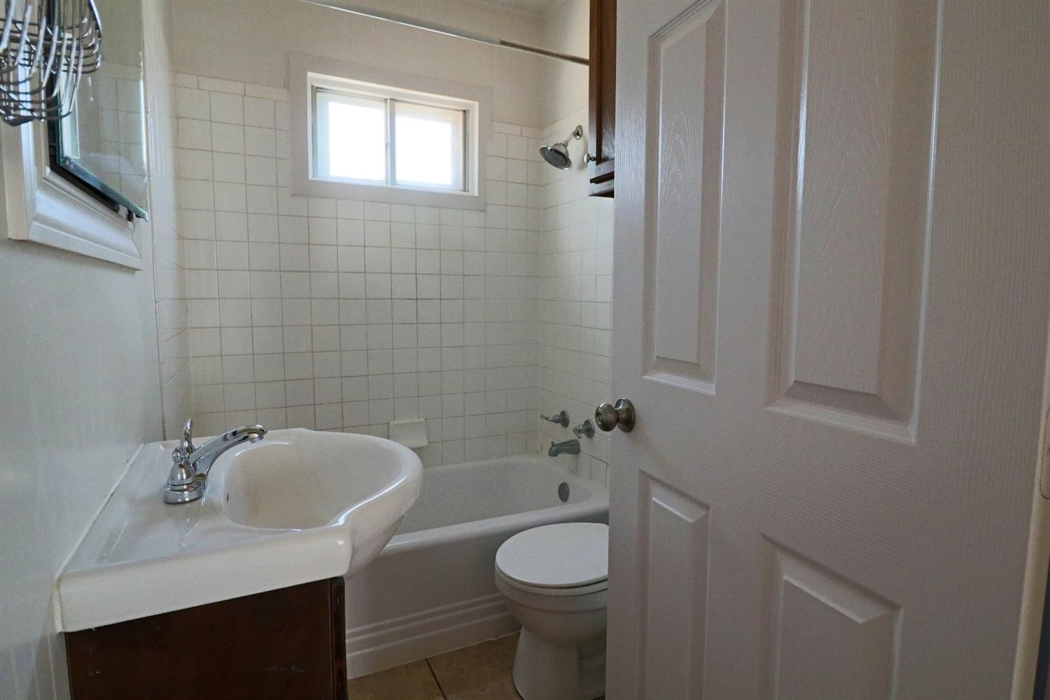 2426 26th Street Lubbock, TX 79411 - Photo 8 of 10 a bathroom with a sink toilet and shower