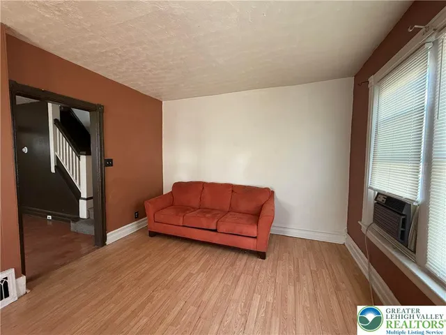 a living room with a couch and a flat screen tv