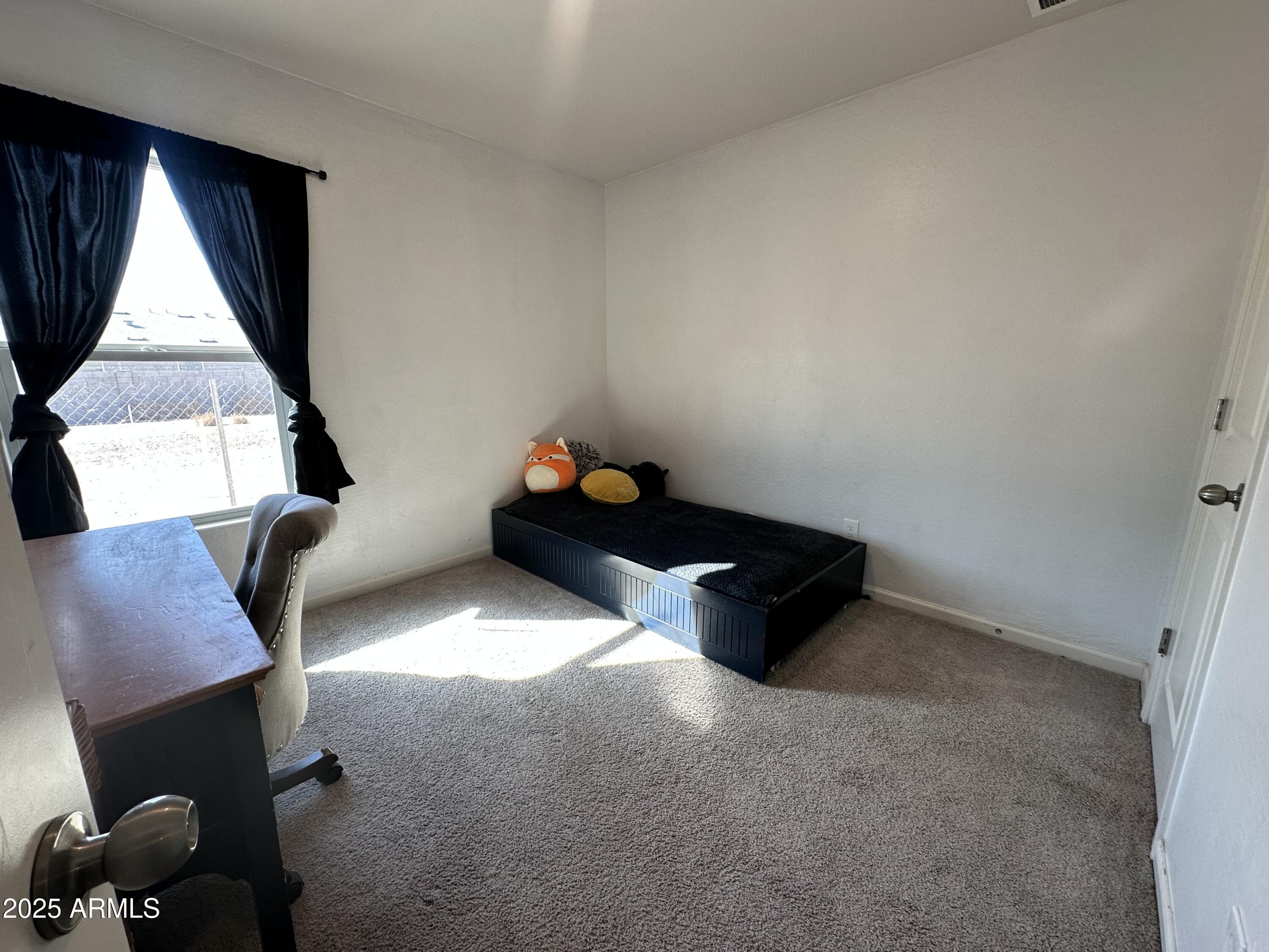 14852 South Diablo Road Arizona City, AZ 85123 - Photo 11 of 30 a living room with furniture and a window