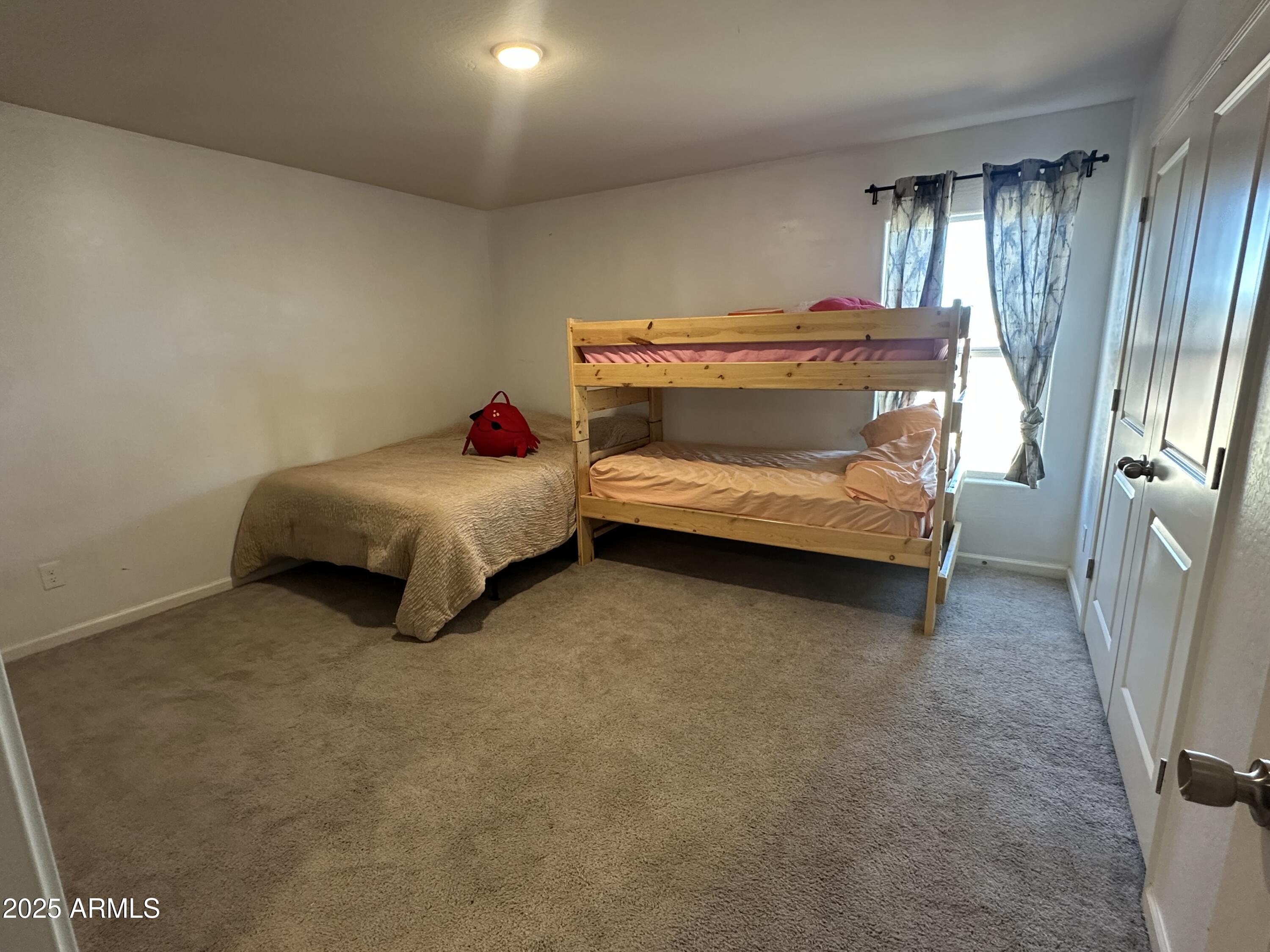 14852 South Diablo Road Arizona City, AZ 85123 - Photo 16 of 30 a bedroom with a bed and a cabinets