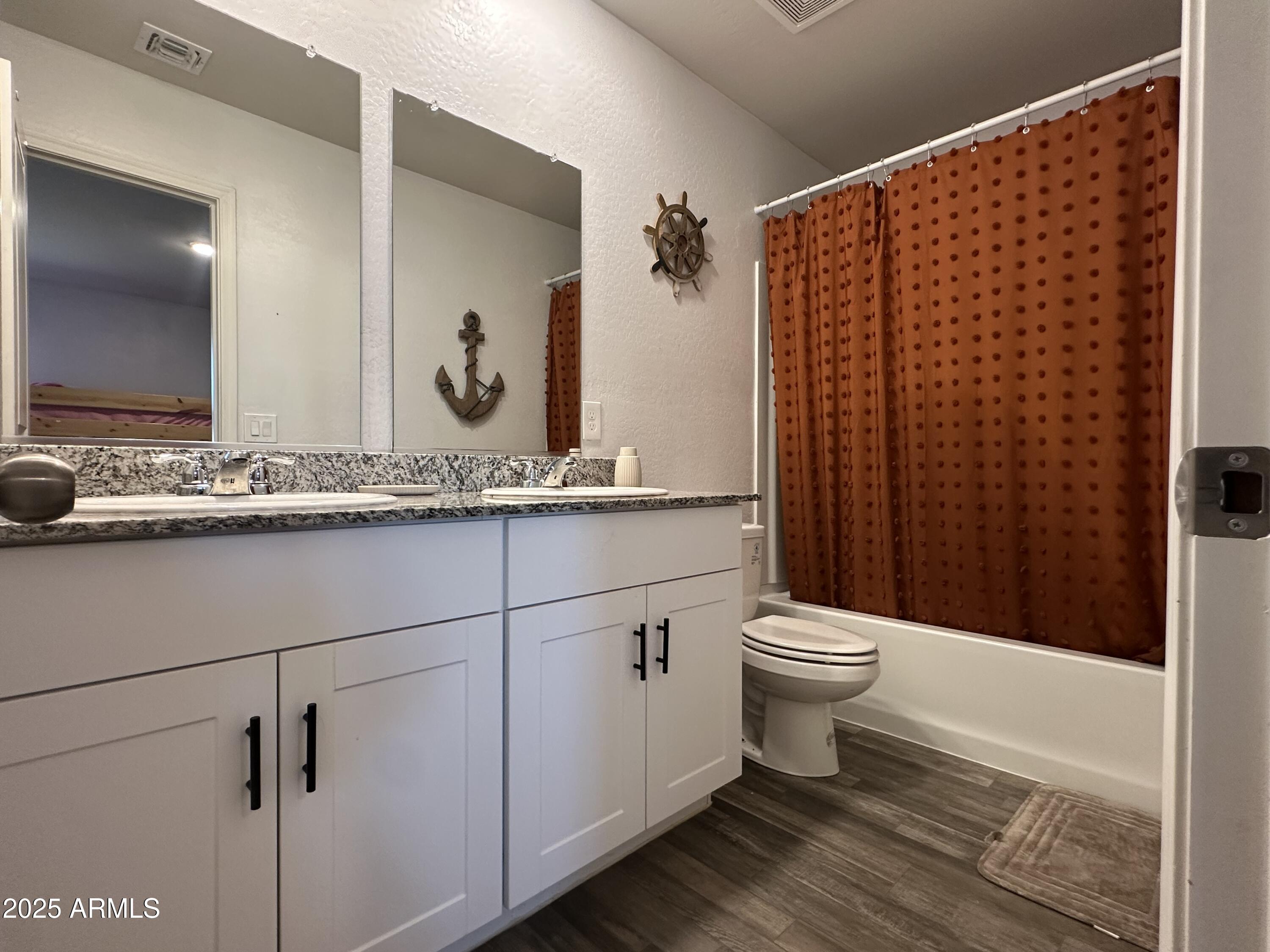 14852 South Diablo Road Arizona City, AZ 85123 - Photo 19 of 30 a bathroom with a sink a toilet and shower
