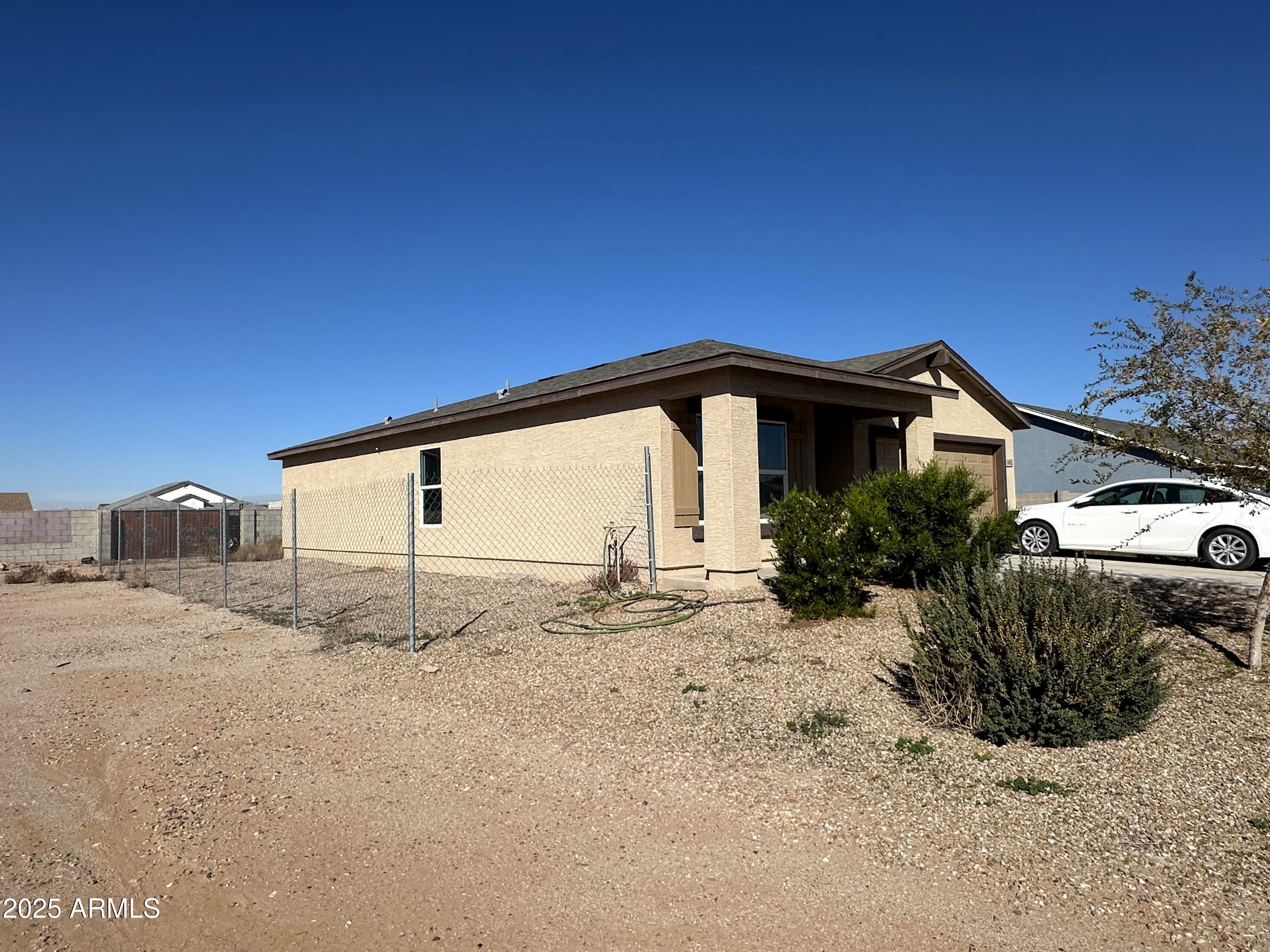 14852 South Diablo Road Arizona City, AZ 85123 - Photo 3 of 30 a view of a house with a snow in the yard