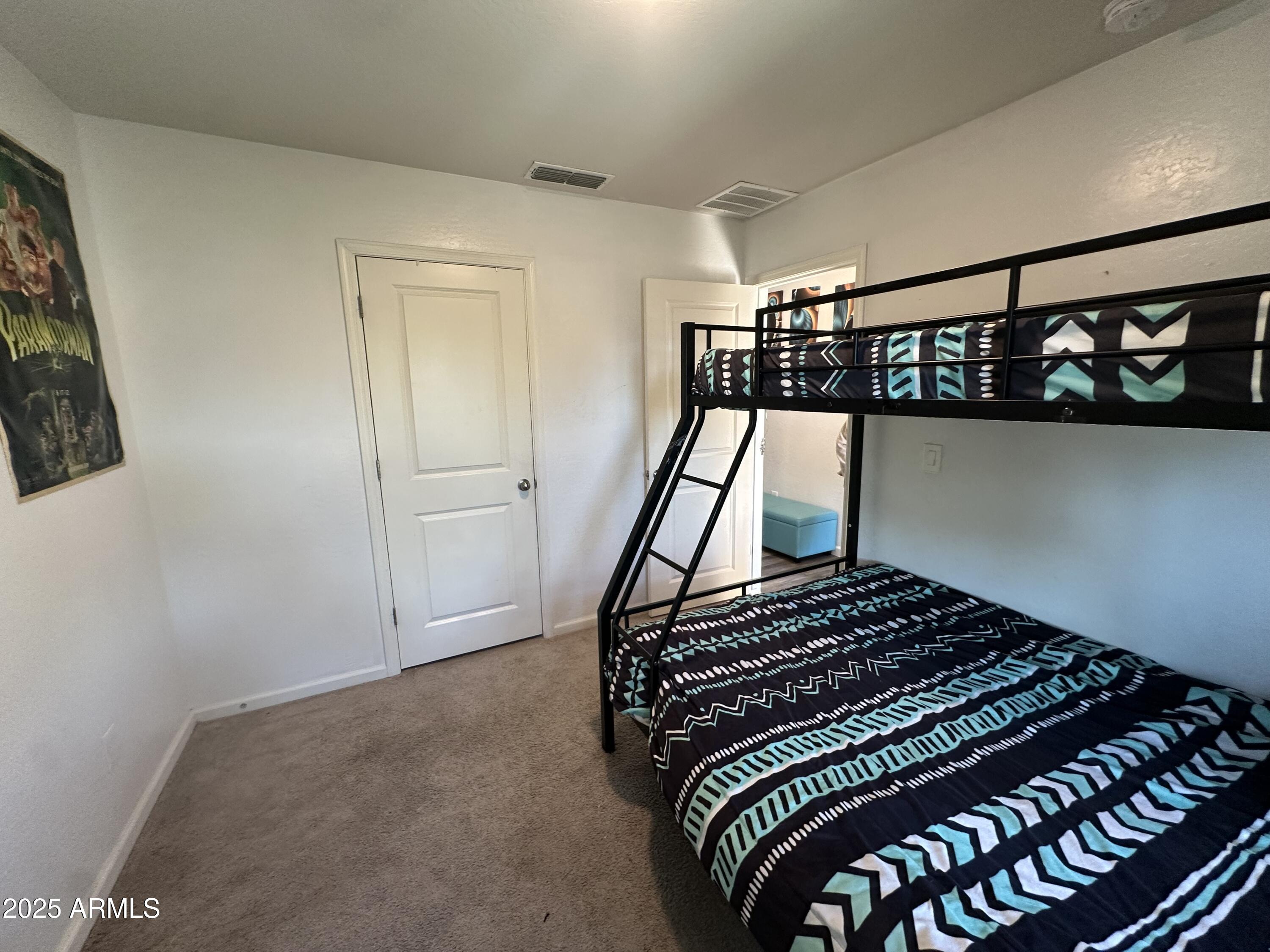 14852 South Diablo Road Arizona City, AZ 85123 - Photo 8 of 30 a bedroom with a bed and a window