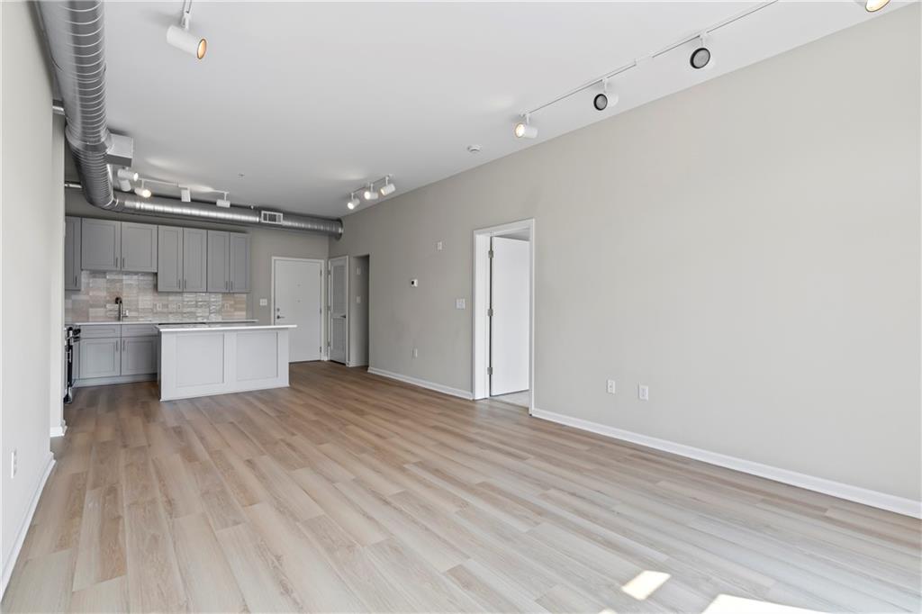 5300 Peachtree Road, Unit 3308 Atlanta, GA 30341 - Photo 13 of 45 a view of a kitchen with wooden cabinet and a refrigerator