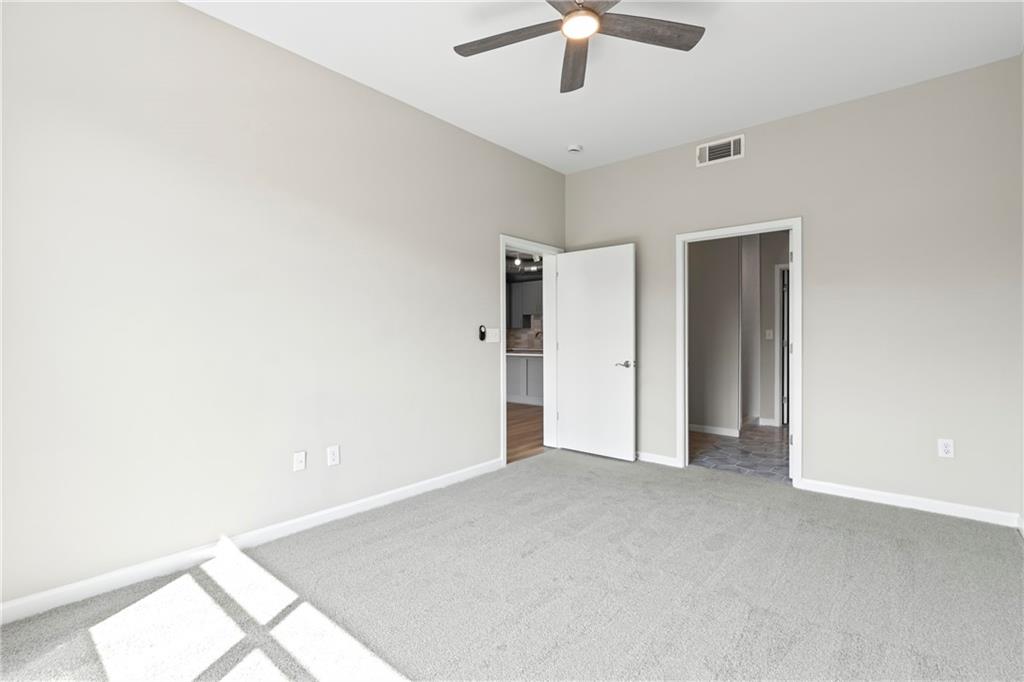 5300 Peachtree Road, Unit 3308 Atlanta, GA 30341 - Photo 15 of 45 an empty room with chandelier fan