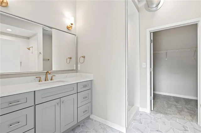 a bathroom with a double vanity sink and mirror