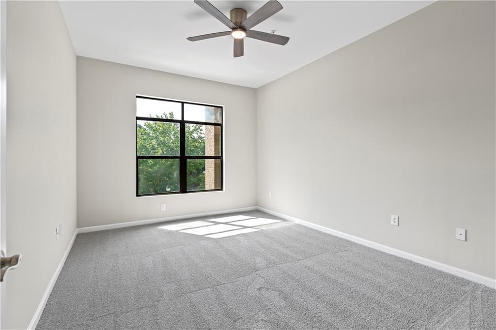 5300 Peachtree Road, Unit 3308 Atlanta, GA 30341 - Photo 24 of 45 an empty room with a window and a fan