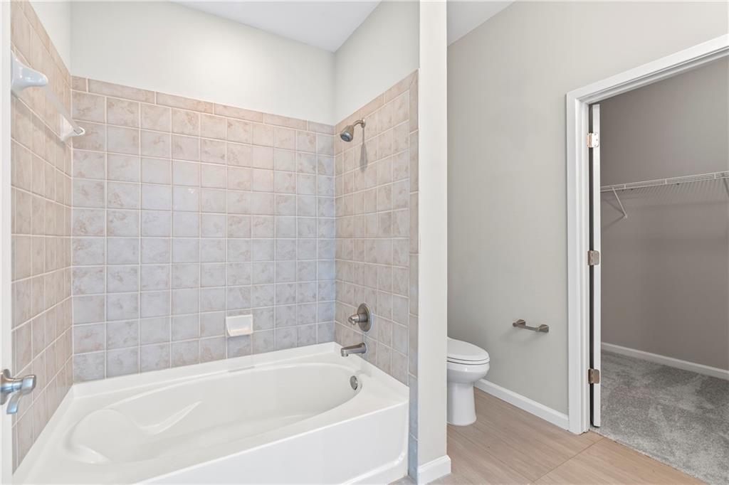 5300 Peachtree Road, Unit 3308 Atlanta, GA 30341 - Photo 28 of 45 a white bath tub sitting next to a white toilet