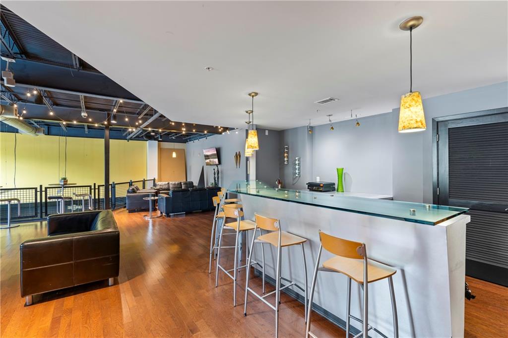 5300 Peachtree Road, Unit 3308 Atlanta, GA 30341 - Photo 34 of 45 a dining room with furniture and a flat screen tv