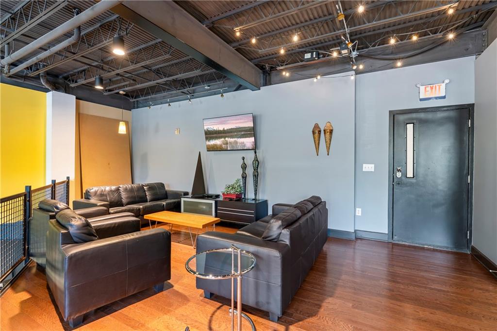 5300 Peachtree Road, Unit 3308 Atlanta, GA 30341 - Photo 36 of 45 a living room with furniture and a chandelier