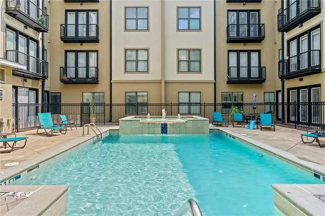a view of a swimming pool with a lounge chair