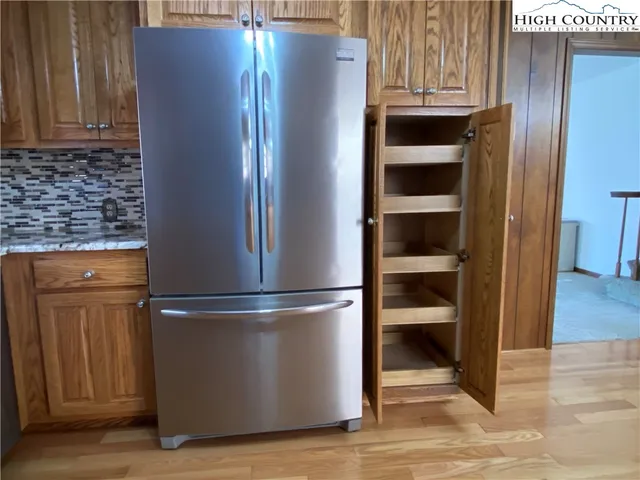 a view of a livingroom with a ceiling fan and window