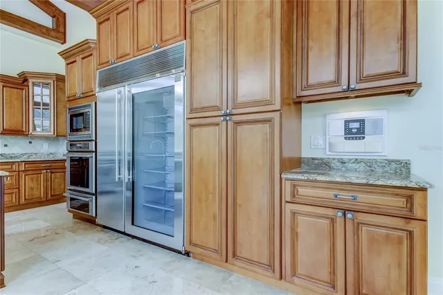 a stove top oven sitting inside of a kitchen