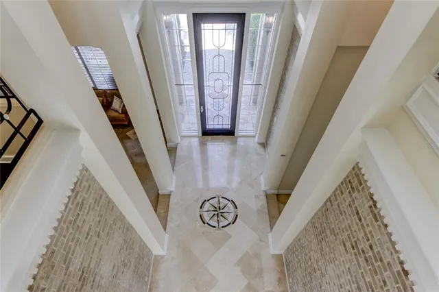 a bed sitting in a bedroom next to a lamp