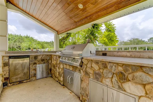 a swimming pool with outdoor seating and yard