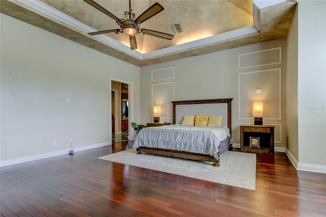 a view of a hallway with entryway windows and cabinet