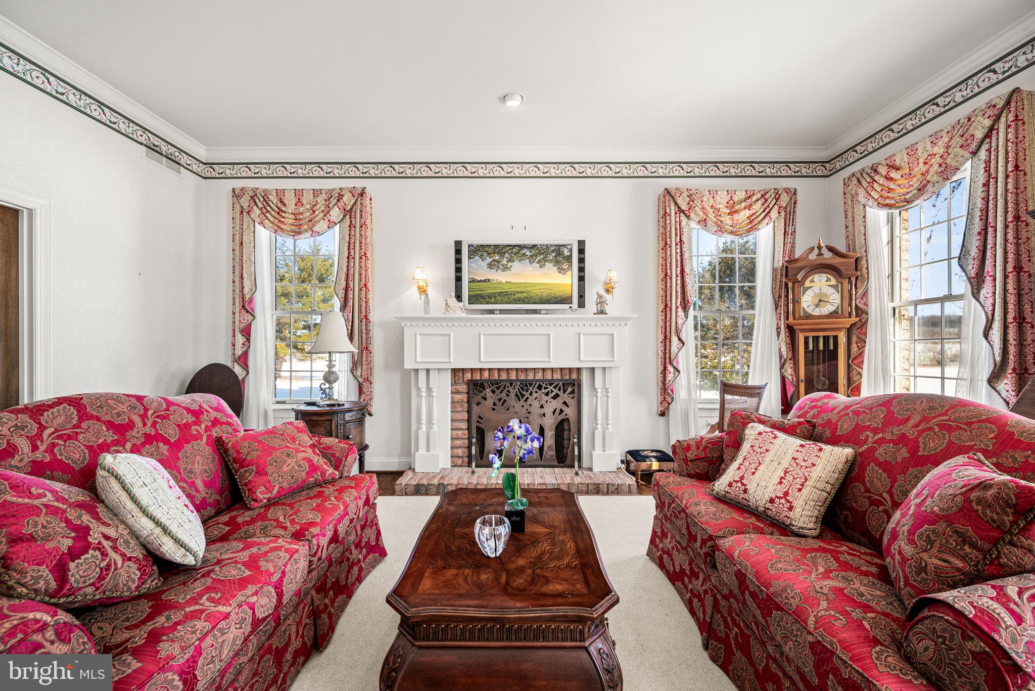 220 Sassamansville Road Gilbertsville, PA 19525 - Photo 16 of 34 a living room with furniture fireplace and a large window