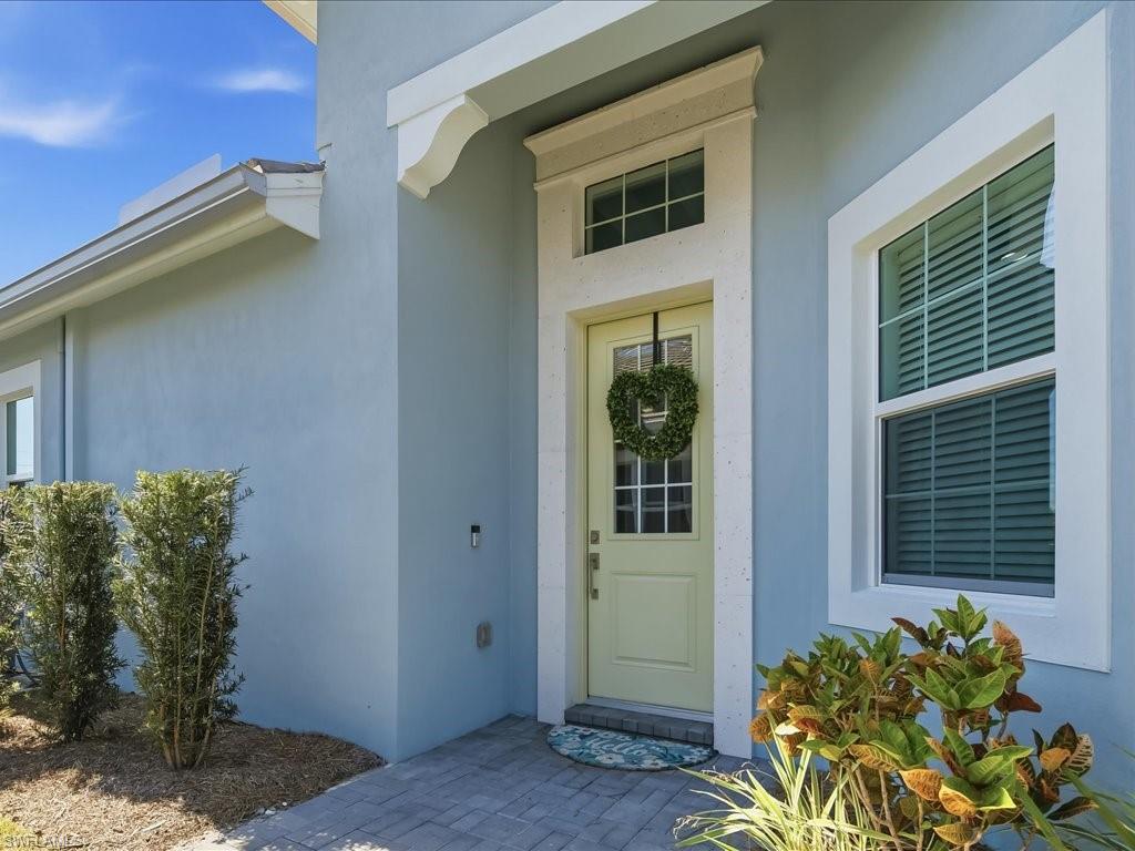 6827 Saona Court Naples, FL 34113 - Photo 14 of 36 a view of a entryway of the house