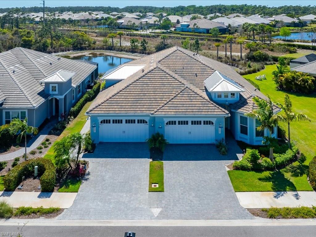6827 Saona Court Naples, FL 34113 - Photo 29 of 36 a aerial view of a house and a yard view
