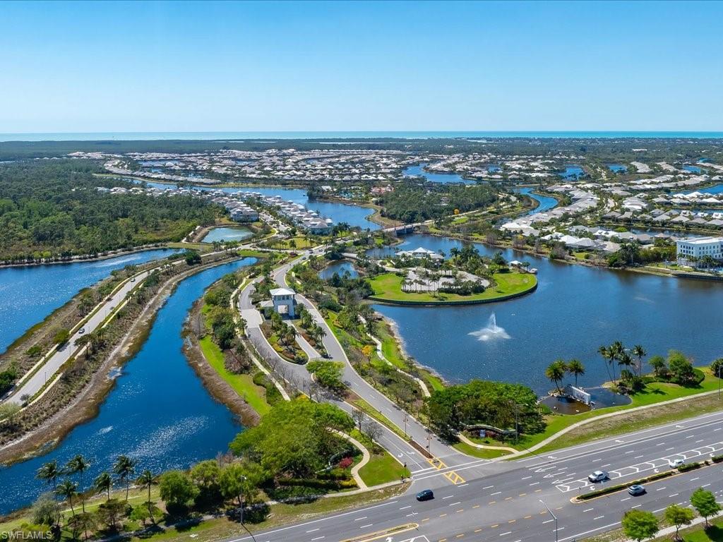 6827 Saona Court Naples, FL 34113 - Photo 31 of 36 an aerial view of a residential houses with outdoor space and swimming pool