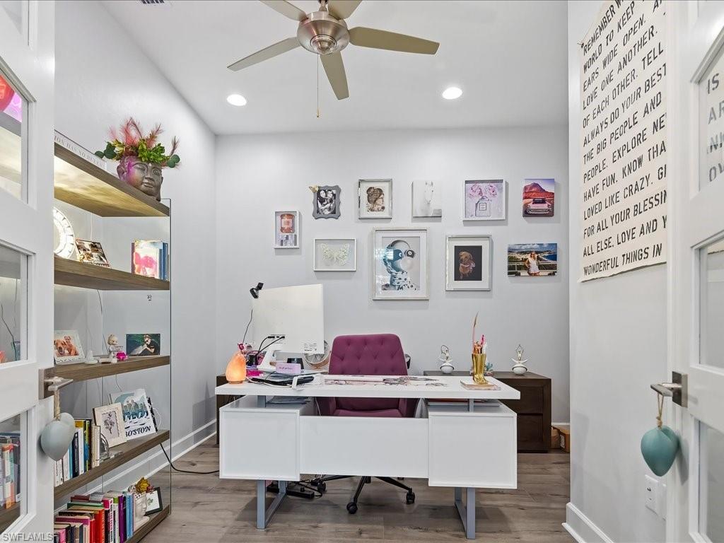 6827 Saona Court Naples, FL 34113 - Photo 7 of 36 a view of a dining room with furniture and cabinet