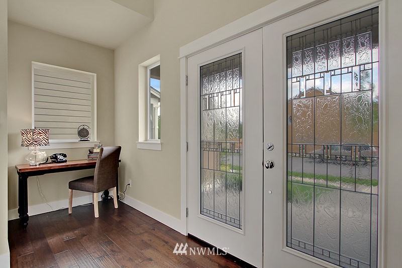 3731 226th Place Southeast Bothell, WA 98021 - Photo 2 of 16 a view of a workspace with furniture and a window