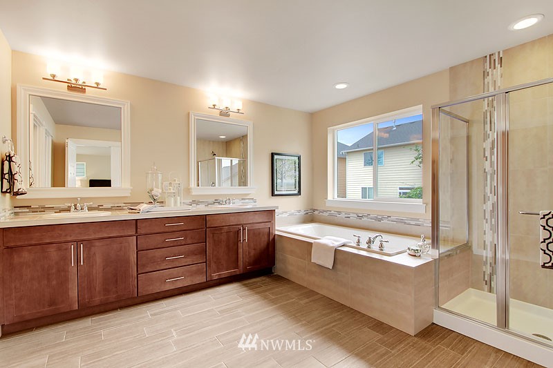3731 226th Place Southeast Bothell, WA 98021 - Photo 15 of 16 a large bathroom with a large tub and sink