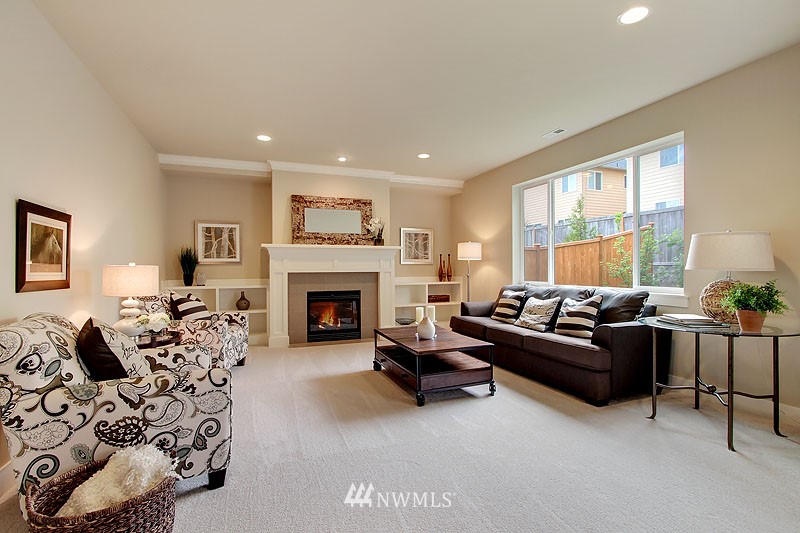 3731 226th Place Southeast Bothell, WA 98021 - Photo 3 of 16 a living room with furniture and a fireplace