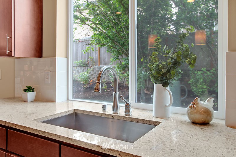 3731 226th Place Southeast Bothell, WA 98021 - Photo 9 of 16 a kitchen with a faucet a potted plant and a counter top space