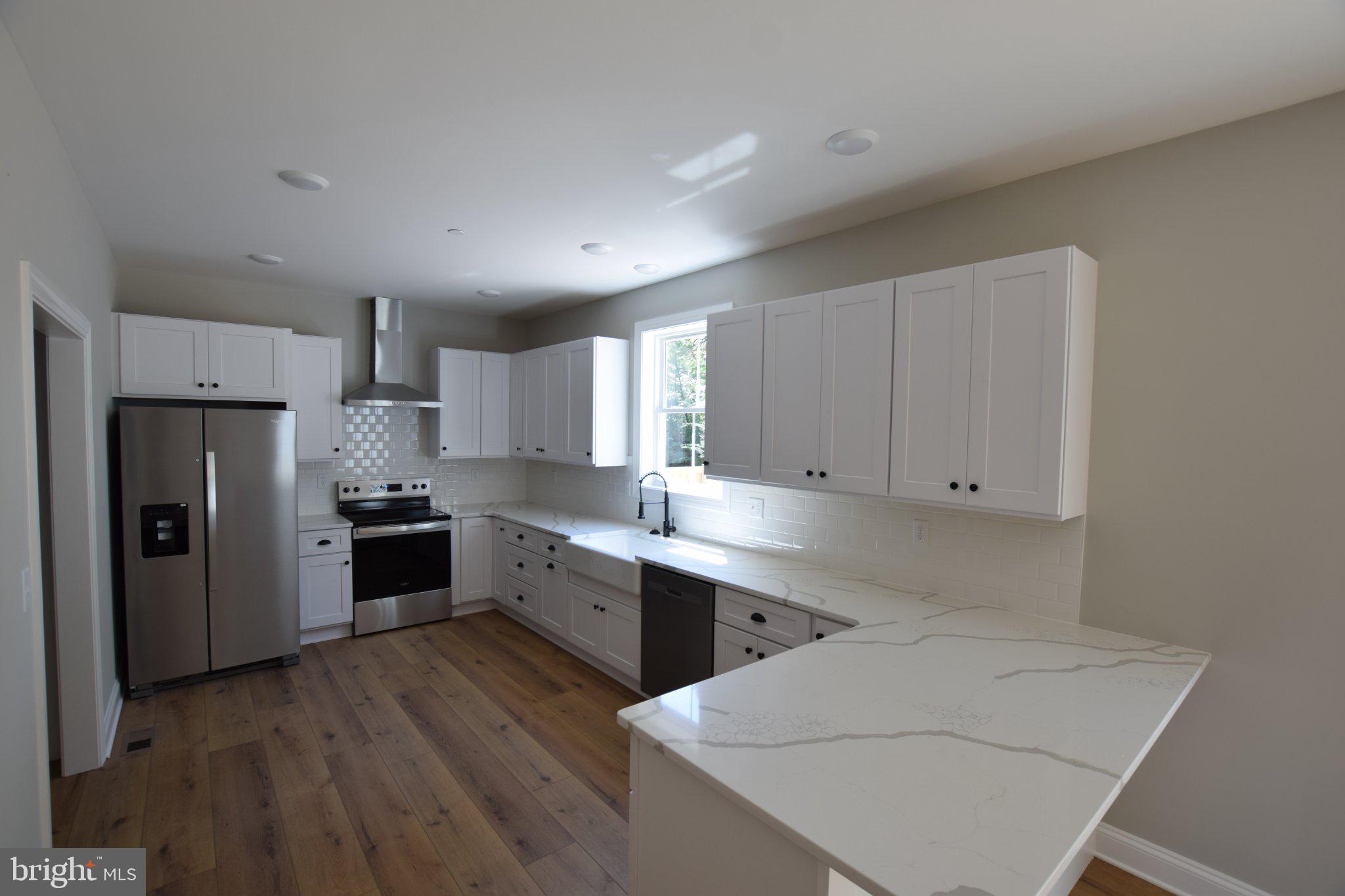 230 Long Point Road Stevensville, MD 21666 - Photo 13 of 41 Modern kitchen with sleek finishes.