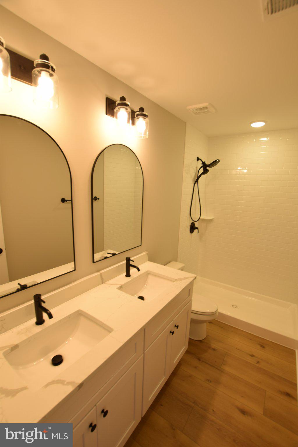 230 Long Point Road Stevensville, MD 21666 - Photo 21 of 41 Sleek modern bathroom with dual sinks.
