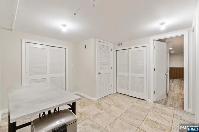 an empty room with a bench