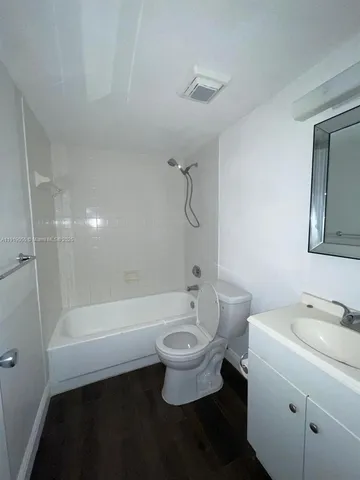 a bathroom with a sink a toilet and a bathtub