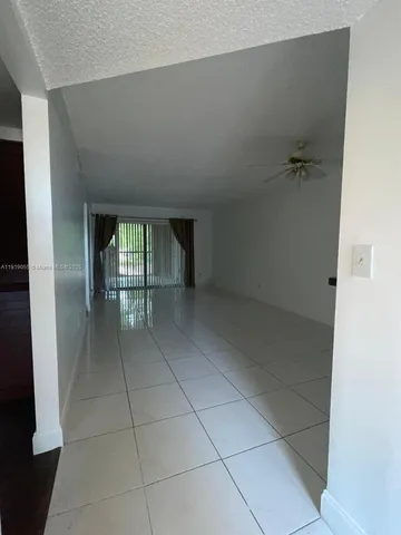 a bed in a bedroom next to a window