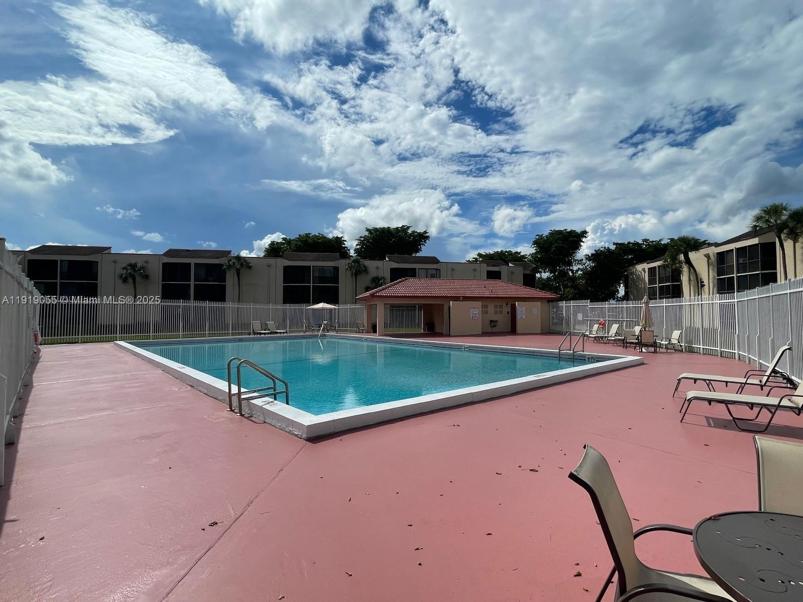 3410 Foxcroft Road, Unit 310 Miramar, FL 33025 - Photo 19 of 21 an aerial view of a house with swimming pool garden and seating