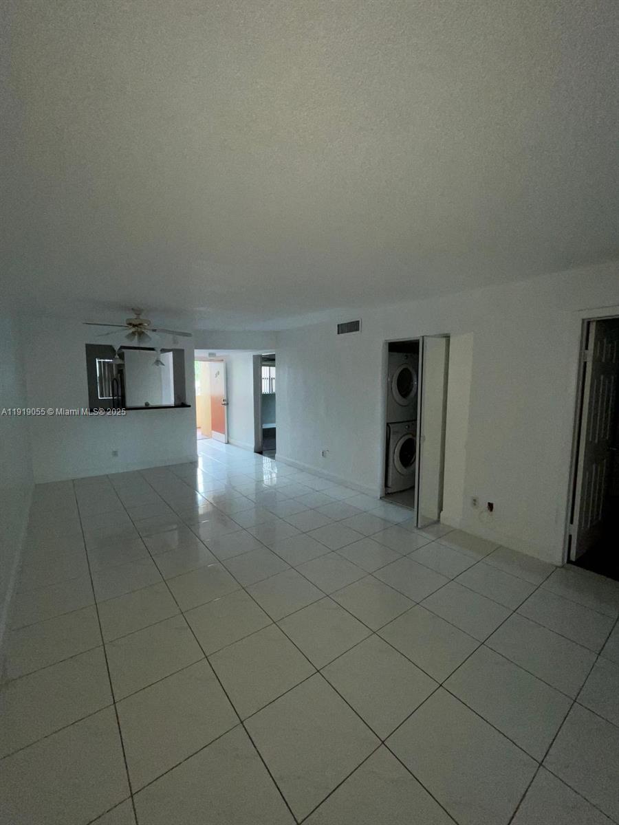 3410 Foxcroft Road, Unit 310 Miramar, FL 33025 - Photo 7 of 21 a view of a kitchen with furniture and an empty room