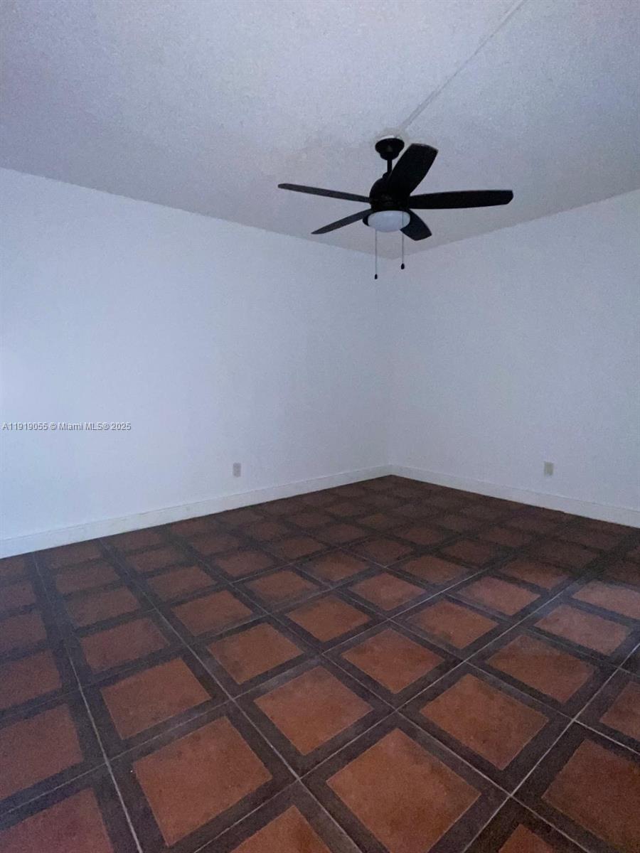 3410 Foxcroft Road, Unit 310 Miramar, FL 33025 - Photo 10 of 21 a view of a room with wooden floor