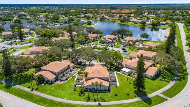 an aerial view of a house with a lake view