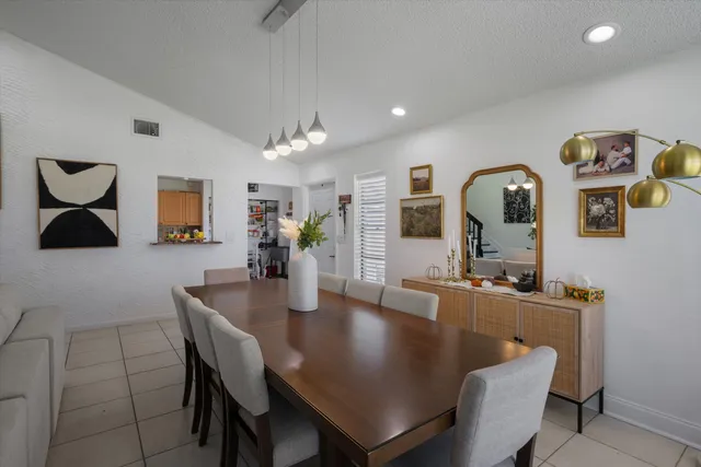a dining room with wooden floor and breakfast area