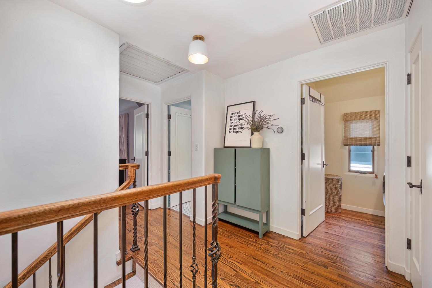3501 Cutter Way Sacramento, CA 95818 - Photo 66 of 89 a view of a hallway with wooden floor and stairs