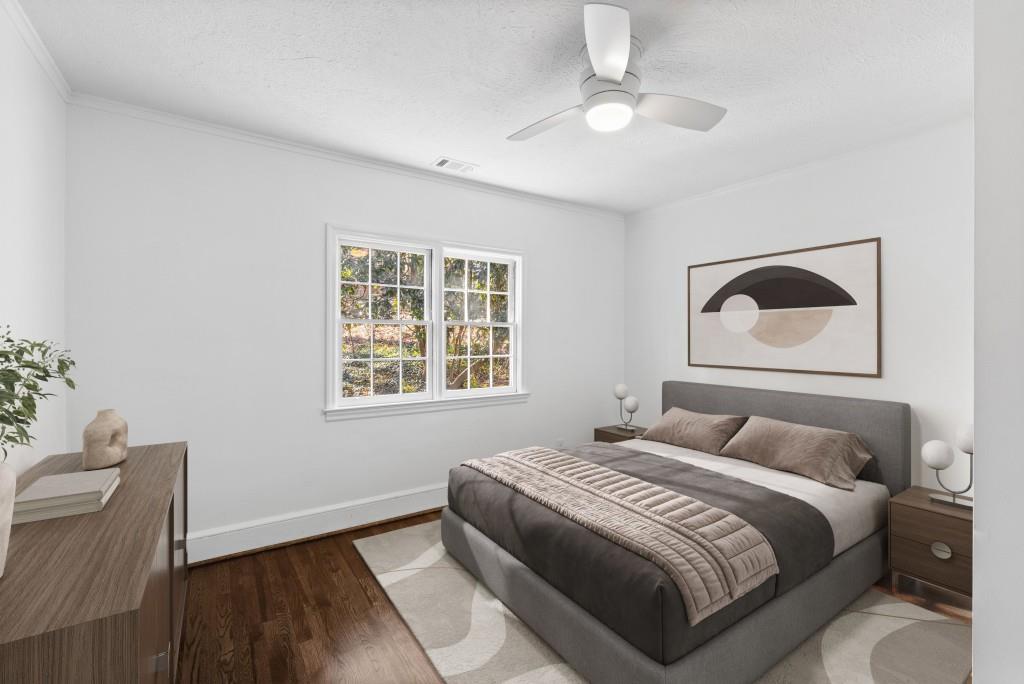 3310 East Roxboro Road Northeast Atlanta, GA 30324 - Photo 11 of 47 a bedroom with a bed and a chair