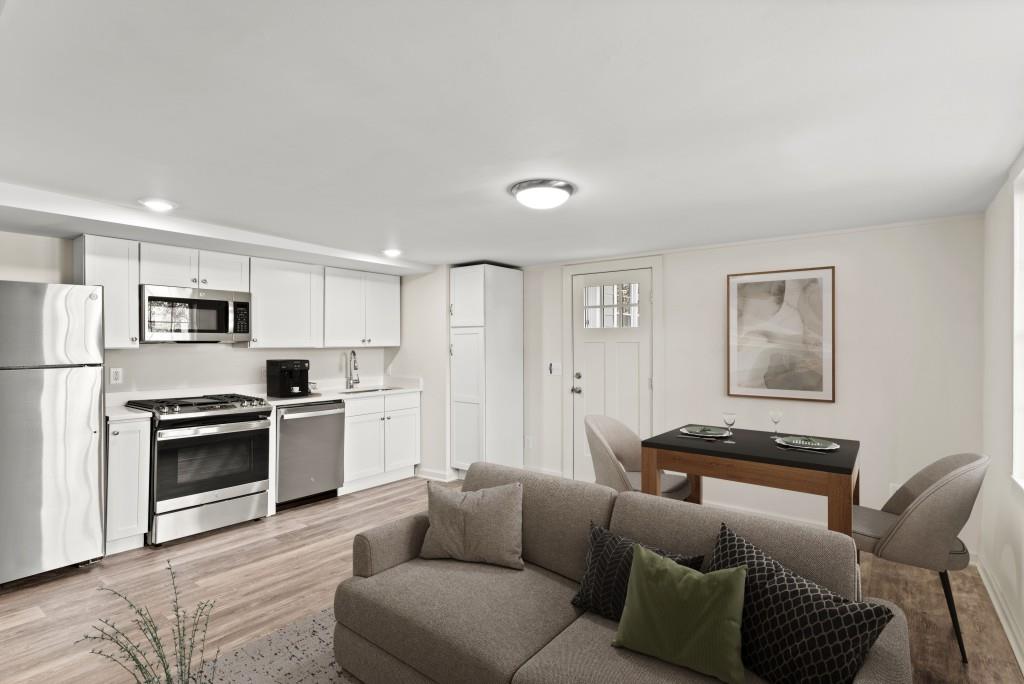 3310 East Roxboro Road Northeast Atlanta, GA 30324 - Photo 25 of 47 a living room with stainless steel appliances furniture and a view of kitchen