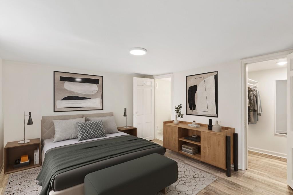 3310 East Roxboro Road Northeast Atlanta, GA 30324 - Photo 30 of 47 a bedroom with a bed and a view of kitchen