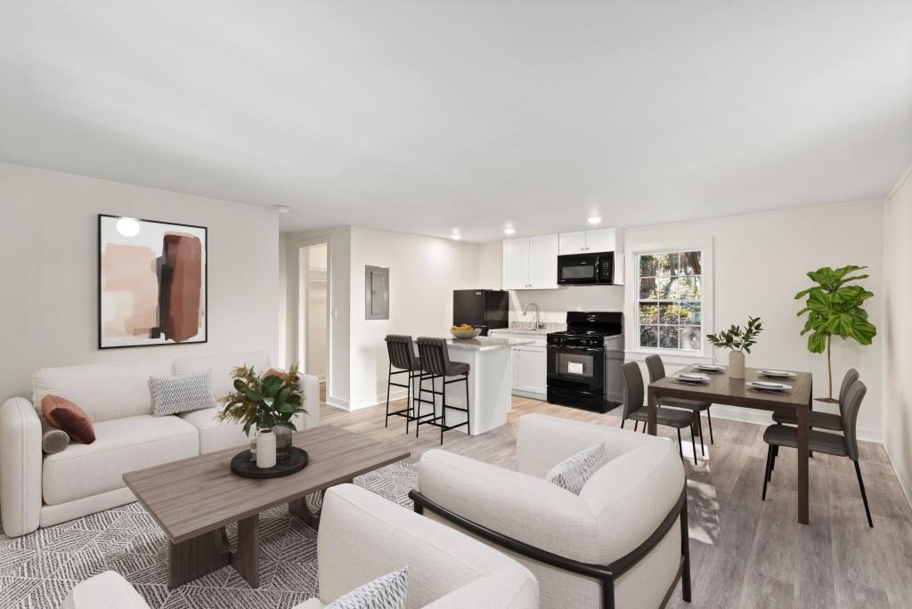 3310 East Roxboro Road Northeast Atlanta, GA 30324 - Photo 37 of 47 a living room with furniture kitchen view and a potted plant