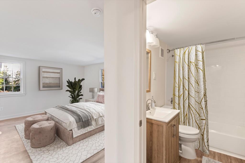 3310 East Roxboro Road Northeast Atlanta, GA 30324 - Photo 42 of 47 a bedroom with a bed and a couch