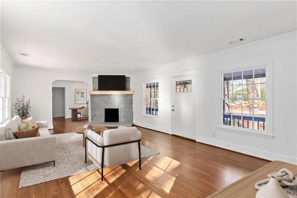 3310 East Roxboro Road Northeast Atlanta, GA 30324 - Photo 6 of 47 a living room with furniture a fireplace and a flat screen tv