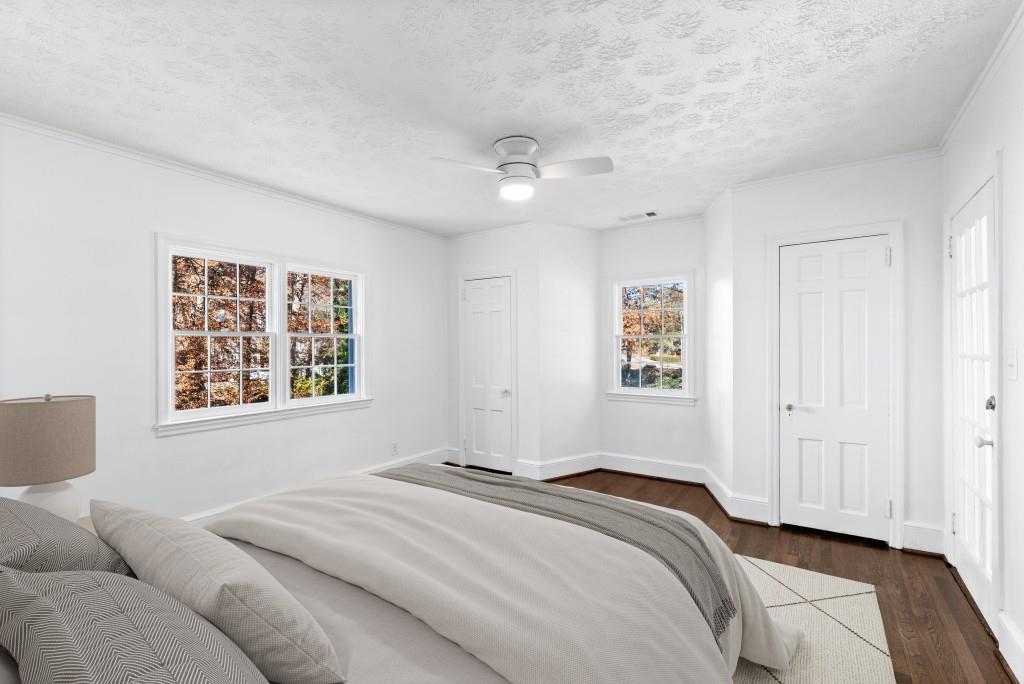 3310 East Roxboro Road Northeast Atlanta, GA 30324 - Photo 8 of 47 a bedroom with a bed and a window